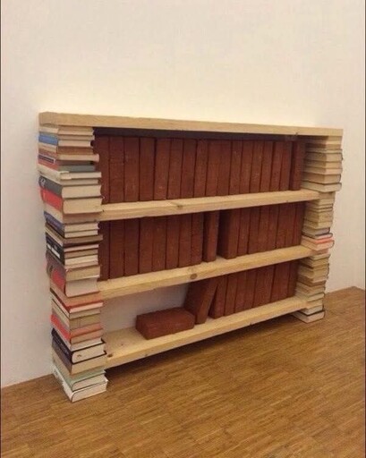 A shelf made out of books that stores bricks